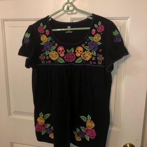 Black shirt with colorful embroidered detail